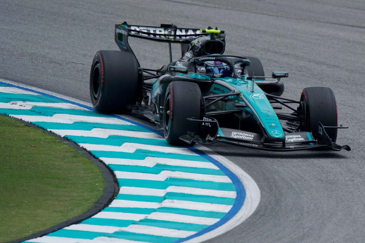Mercedes viewed from above with its wheels on the curved kerb at Sepang Circuit